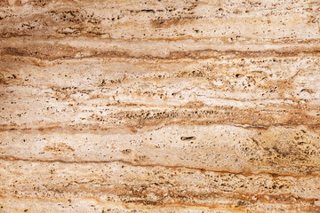 Fototapeta na wymiar stony brown-yellow texture with horizontal stripes with scratches and sand
