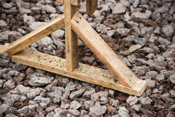 Wooden stand on the gravel