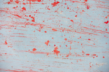Red color scratch  on gray plate
