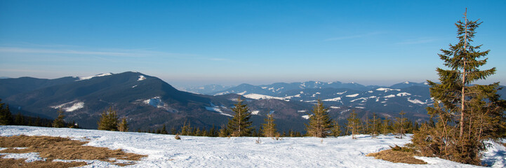 Beautiful winter panoramic view of snow capped mountains