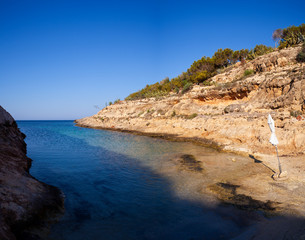 View of Cala Greca in the summer season