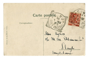 Back of historical french postcard: a letter with a red Italian postage stamp with portrait of king of Italy Victor Emmanuel III, postmark cancellation, The Italian Kingdom