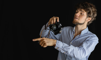 Bearded man taking photo. Photographer with old  fashion camera