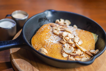 Pancake set on wooden table - brown food and drink dessert concept