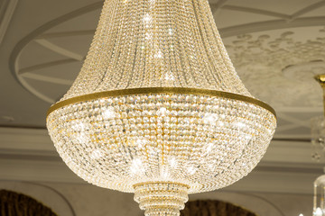 Beautiful crystal chandelier of a round form with gilding