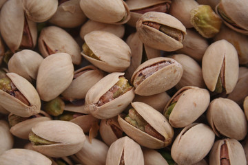 Pistachios background in selective focus. Nuts background