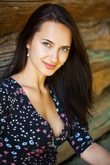Fototapeta premium Young brunette woman in summer park