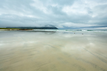 Fototapeta na wymiar Summer cloudy Ramberg beach, Norway, Lofoten