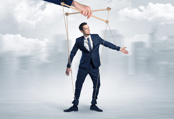 Puppet man with big city great power concept
