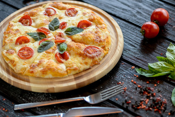 pizza with tomato and cheese