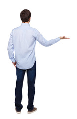 Back view of man looking at wall and Holds hand up.