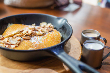 Pancake set on wooden table - brown food and drink dessert concept