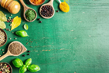 Spices and herbs on wooden background - obrazy, fototapety, plakaty