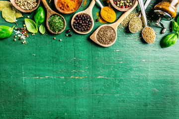 Spices and herbs on wooden background