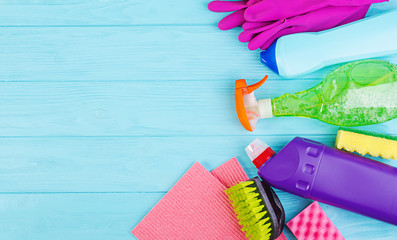 Cleaning service concept. Colorful cleaning set for different surfaces in kitchen, bathroom and...