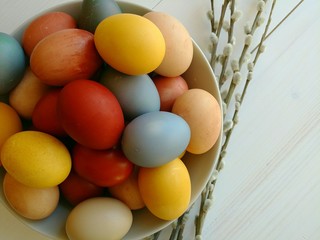 Natural dyed eggs with items from pantry. Easter holiday.