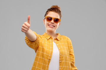 summer, eyewear and people concept - smiling red haired teenage girl in sunglasses and yellow...