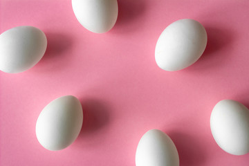 Easter egg frame. pink and white colors on pink background with place for inscription