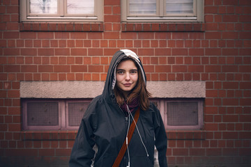 portrait of a smiling young woman with parka © Armin Staudt