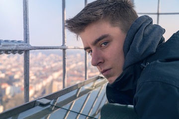 portrait of a young man on an observation tower