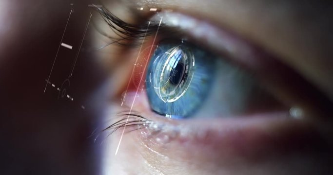 Slow motion of young male blue eye with high technology futuristic virtual reality for personal safety scanning.