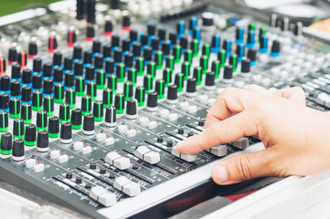Man control sound mixer console panel board - people with music controler technology concept