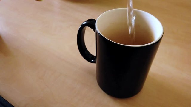 To make that tea, you need to pour that hot water (Slow-Motion)