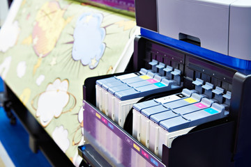 Wide format printer for on fabric and paper