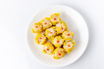 Chinese steamed shrimp dumplings on white dish