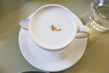 white cup of coffee on the table
