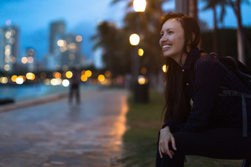 Happy college student woman enjoying the city park.