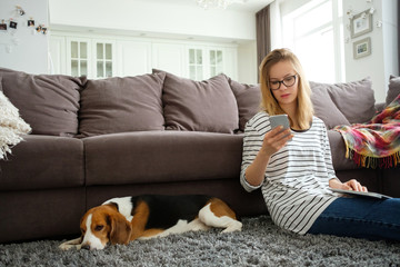 Girl spends time at home with a dog