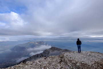 Fototapeta na wymiar Woman on top of Mount Tomorr, Albania, looking into the distance