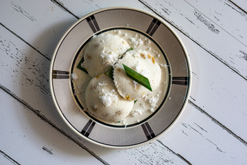 "Putu Piring" is traditional Malaysia dessert made from coconut, rice flour and palm sugar, steamed cook.