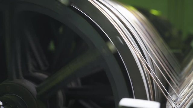 Metalworking and steel production, the process of winding and electroplating, brass wire on reels, rotating spools metal cord.