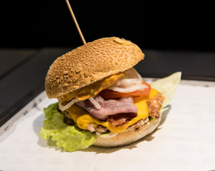 Fresh tasty burger on a wood table