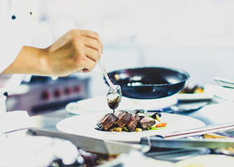 Chef preparing food, meal, in the kitchen, chef cooking, Chef decorating dish