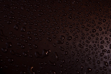 Water drops on a black background.