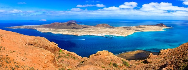 Fototapeta na wymiar Scenery of volcanic Lanzarote - panoramic view from Mirador del Rio, view of Graciosa island