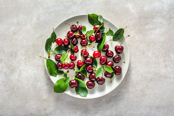 Fresh cherries. Red sweet cherry fruit with leaves