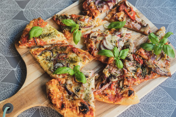 Pizza pieces upcut on a cutting board