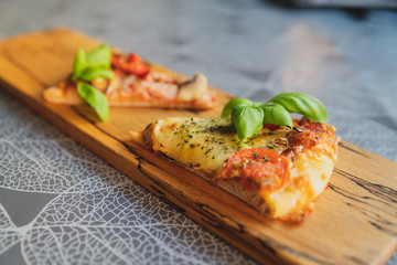 Pizza pieces upcut on a cutting board