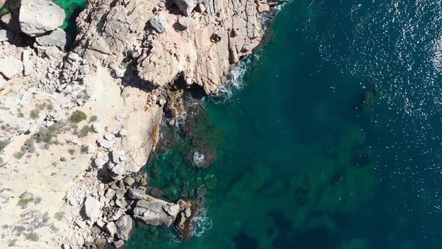 Cliffs in Llevant cove beach in Benitatxell, Alicante, Spain