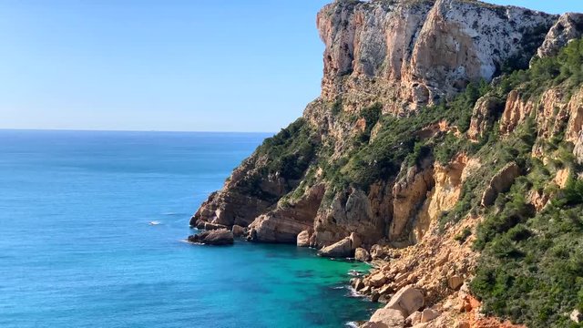 Cliffs in Llevant cove beach in Benitatxell, Alicante, Spain
