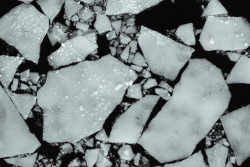 Ice floes on the water, top view - spring background
