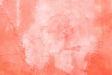 Metal surface carelessly painted in coral color, background