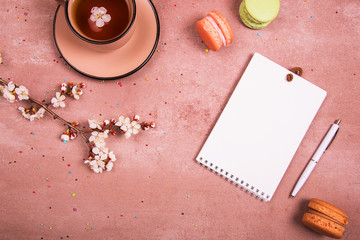 A cup of tea in the spring decoration. View from above. Place for text.
