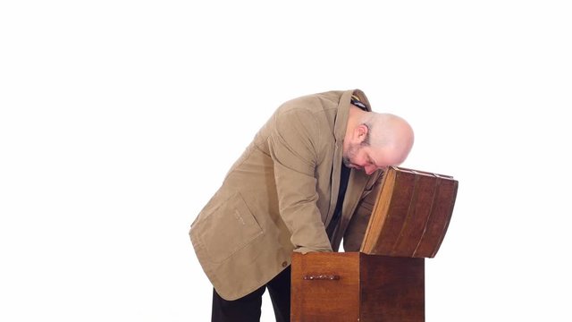 modern man opening antique chest  white screen