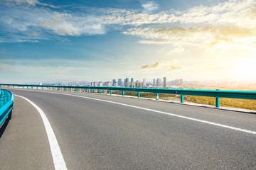 Fototapeta premium Asphalt highway passing through the city above in Shanghai at sunset