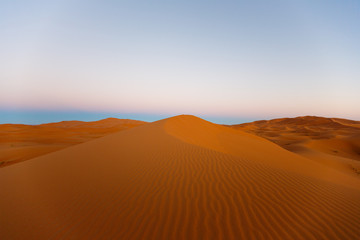 Fototapeta premium Amazing view of the great sand dunes in the Sahara Desert, Erg Chebbi, Merzouga, Morocco.